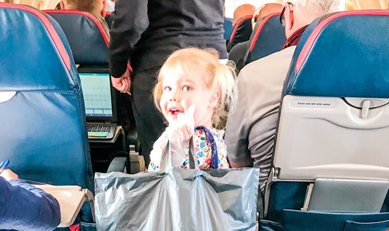 How to Actually Enjoy Flying With a Toddler on Your Lap